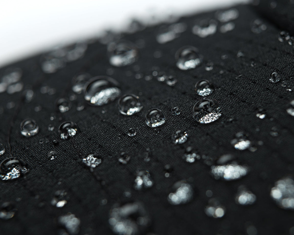 Satisfy Rippy Air Trail Cap in Black, water-repellent fabric
